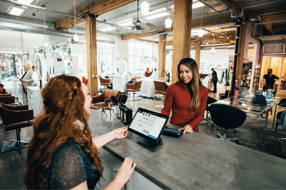 woman making a purchase at a store