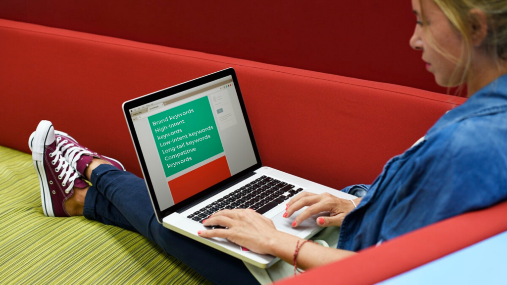 woman using laptop on a couch