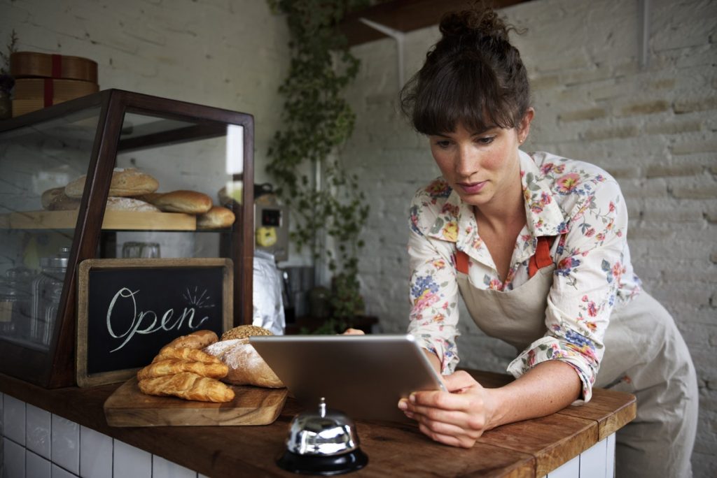 woman on a tablet updating google my business page