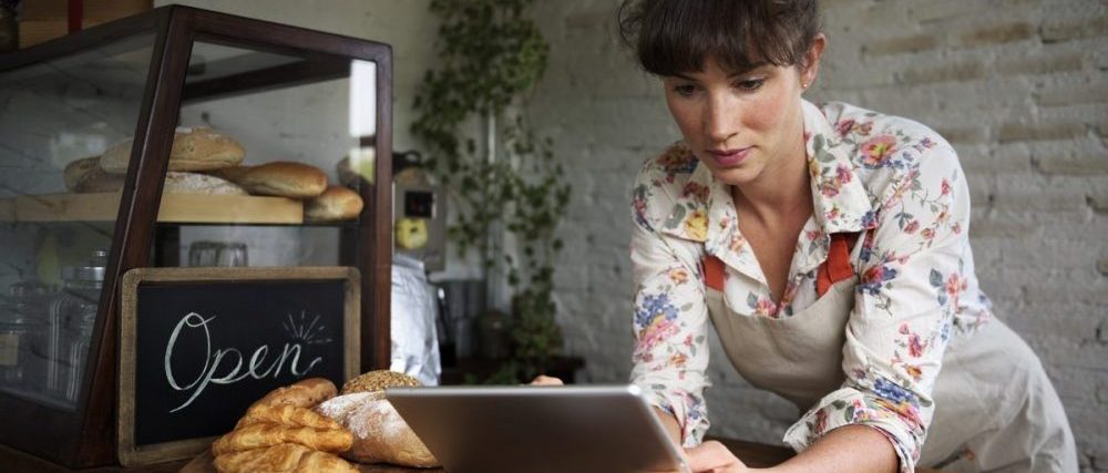 woman on a tablet updating google my business page