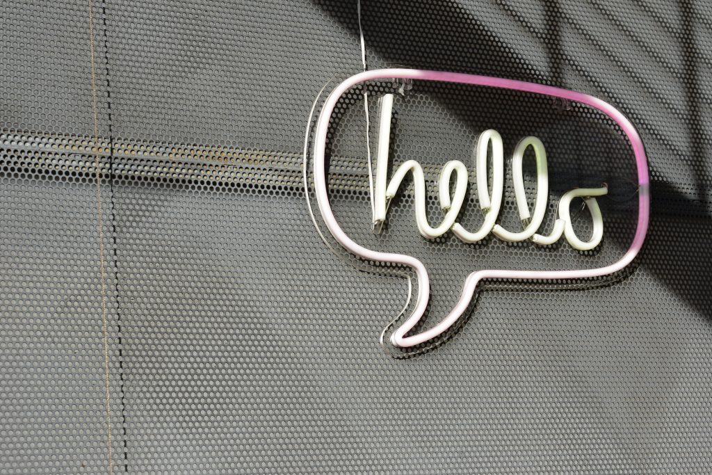 neon light bubble that says hello inside it