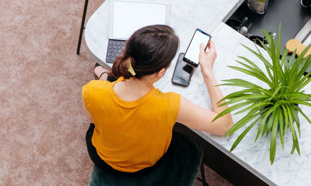 woman checking email on phone