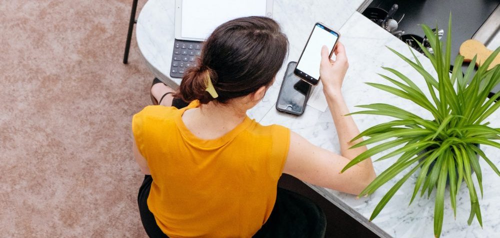 woman checking email on phone