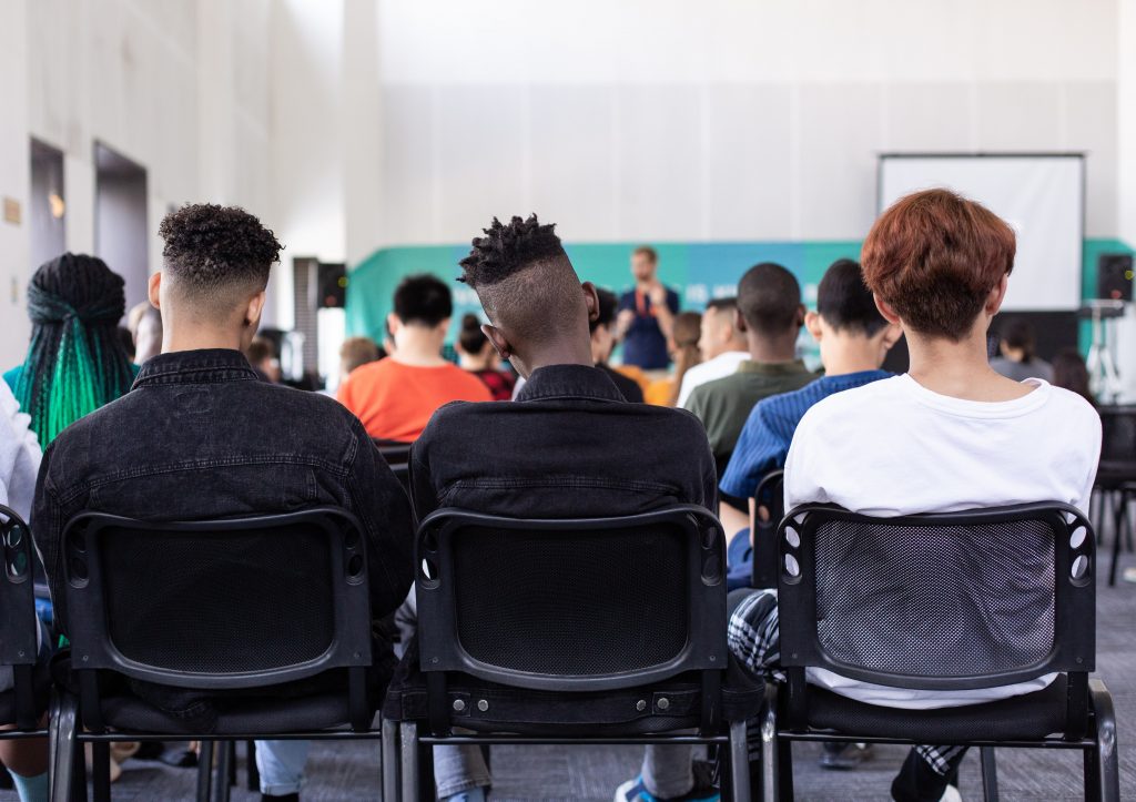 audience of people indoors at a presentation