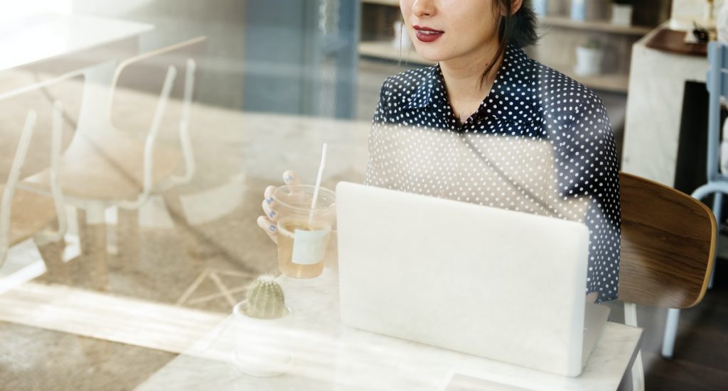 woman at computer with coffee