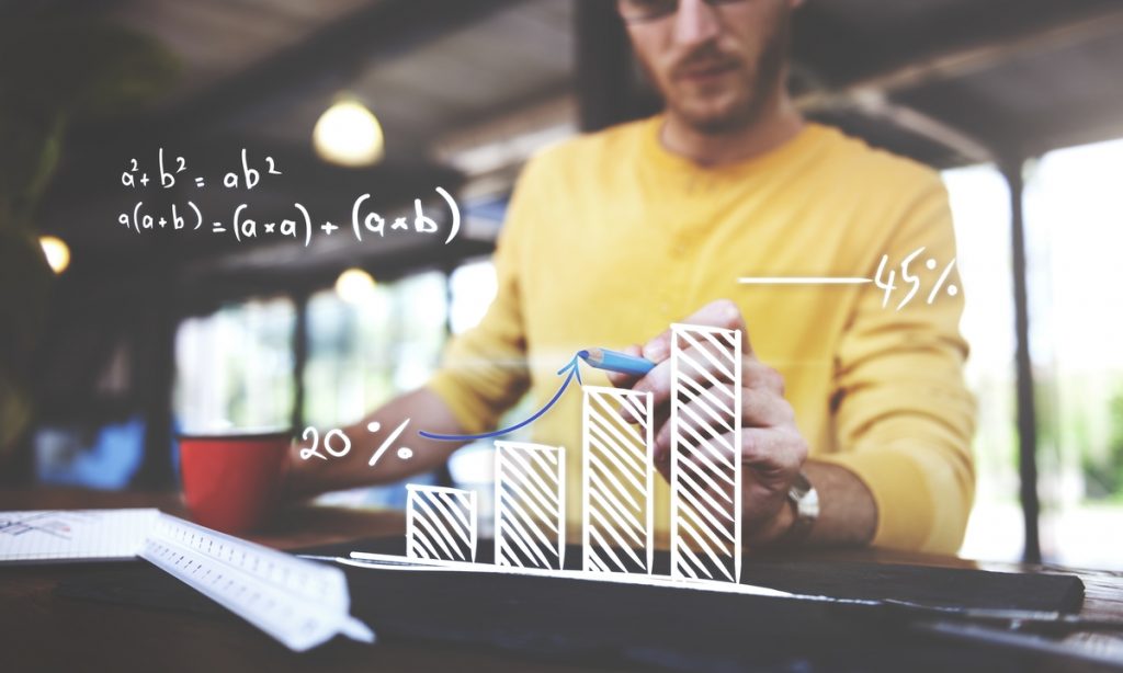 Closeup of man writing arrow up graph increase