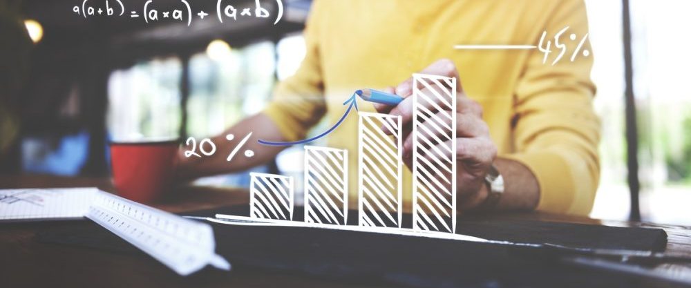 Closeup of man writing arrow up graph increase