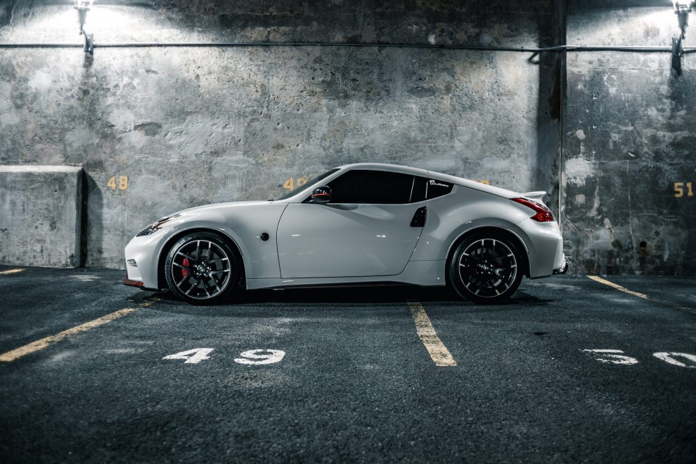 white sports car in a parking garage