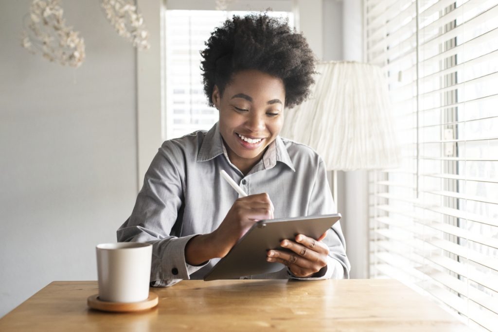 woman using tablet at a table