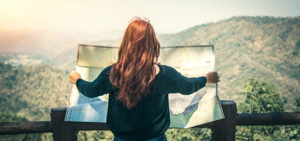 Travelers explore the mountainous forest map.